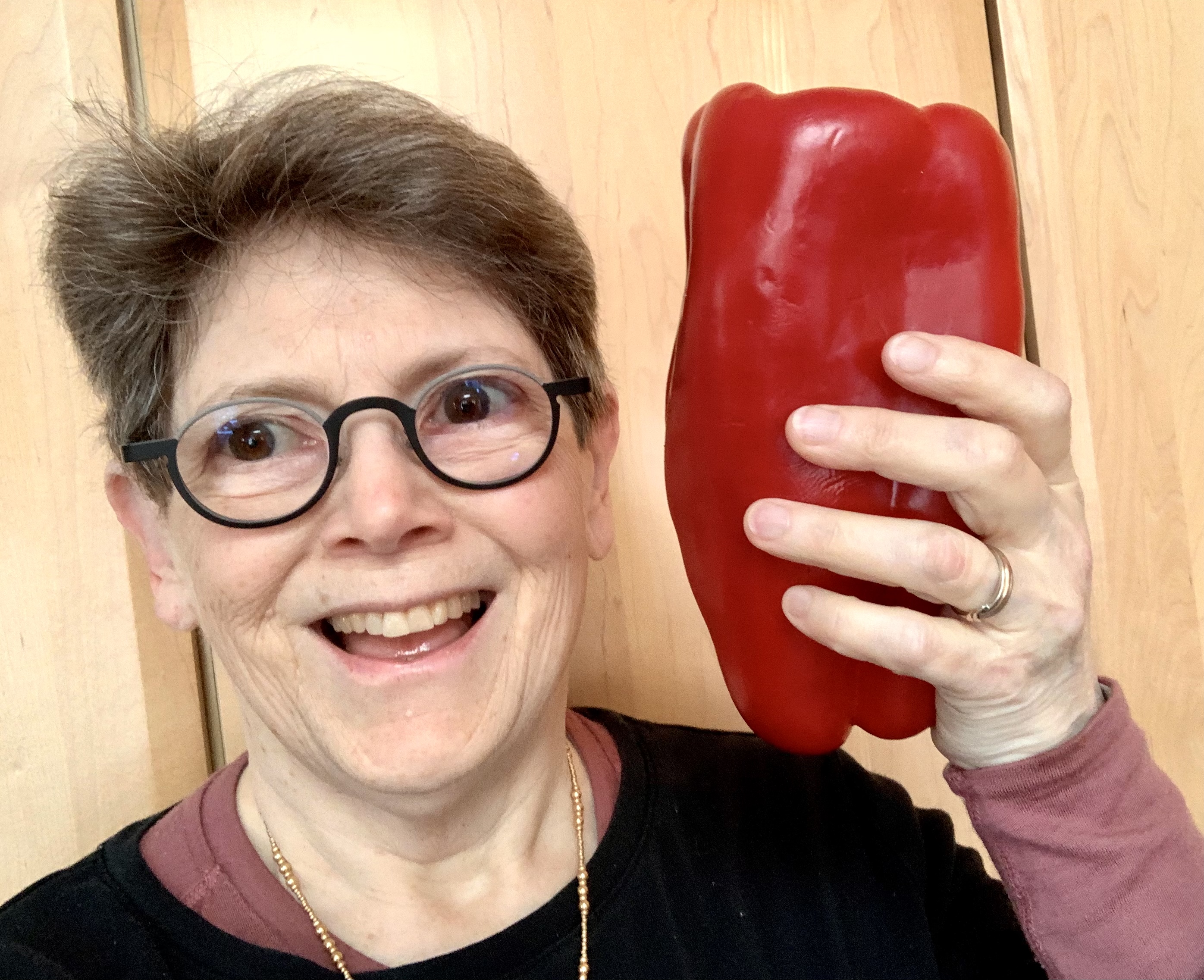 I’m holding the pepper next to my head and my head is smaller