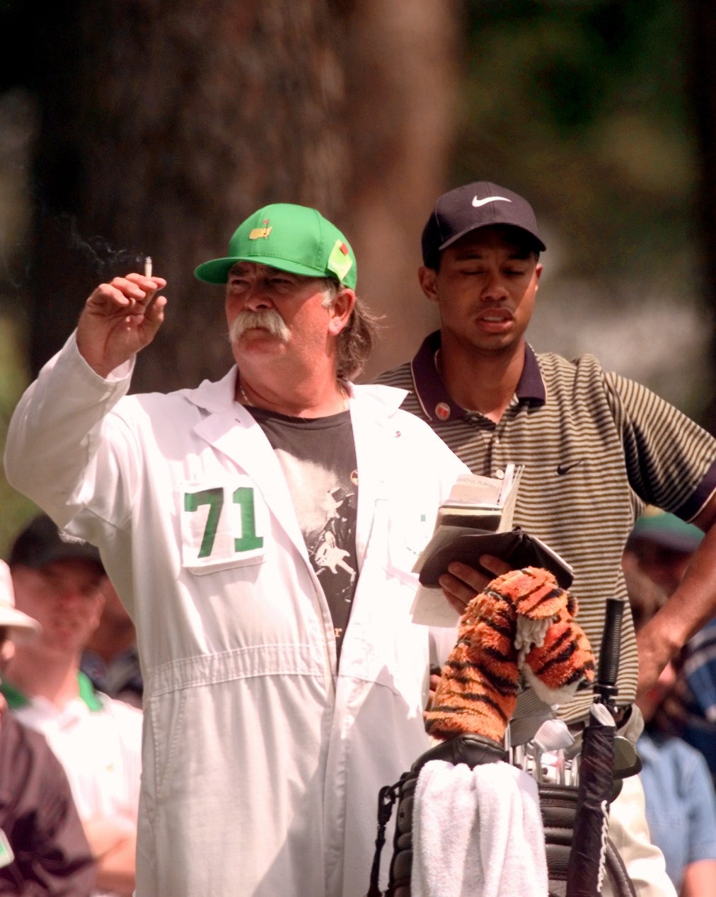fluff tiger cigarette Fluff Cowan, Tiger Woods' caddie, checks the wind with his cigarette at the  1997 Masters Tournament
